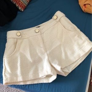 Brand new white shorts with cute design.